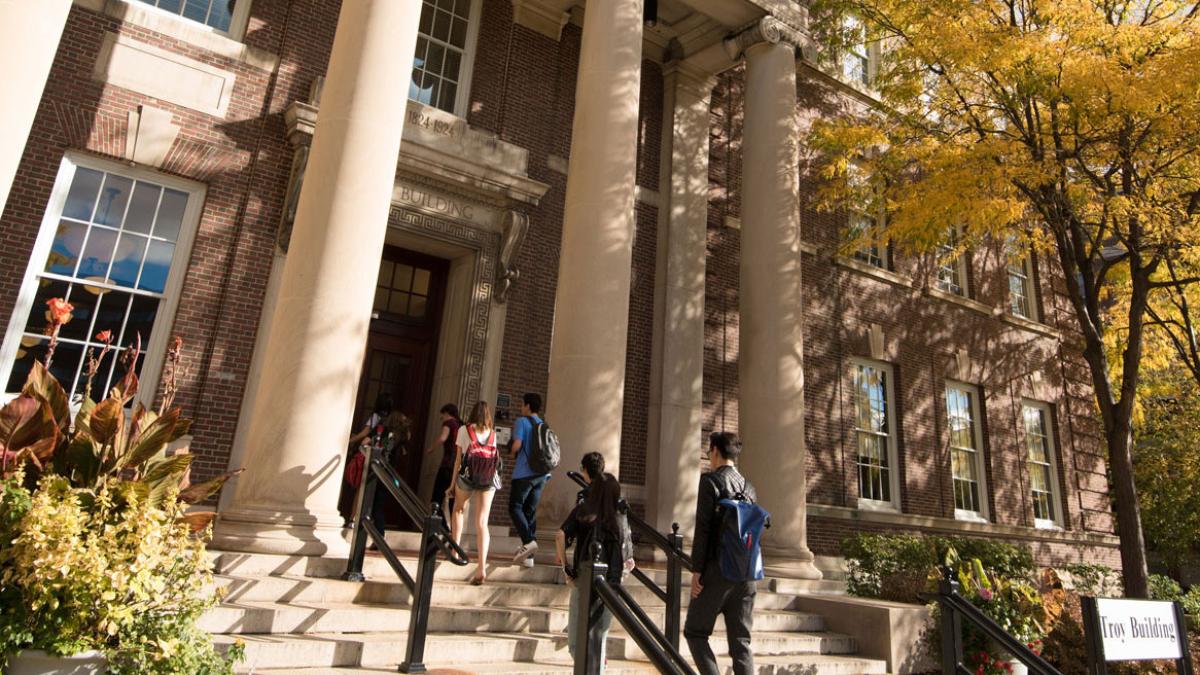 People entering a building on campus.