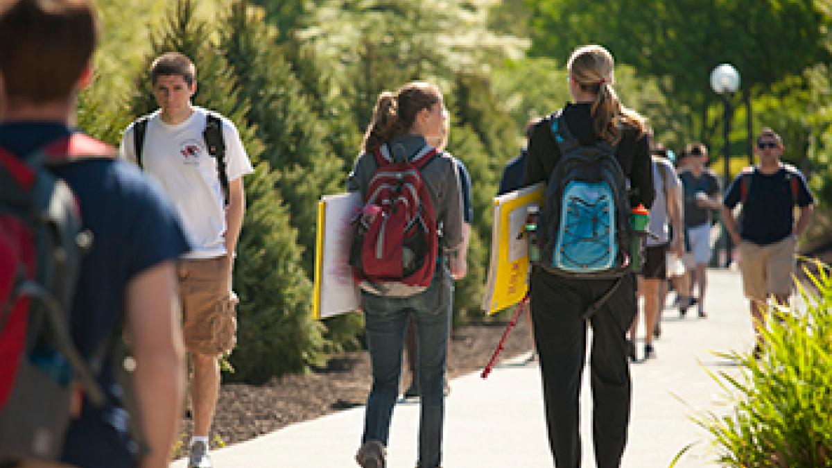 Students walking outside on campus.